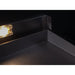 Stono Outdoor Living Close-up of the sleek black metal corner of the Le Griddle Pro Series 75 - 2 Burner Natural Gas (OML75P6) with interior lights, featuring sharp edges and a partial warm light on the left, set against a dark background.